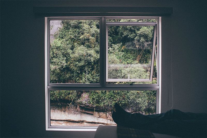 A man relaxing on watching window side 