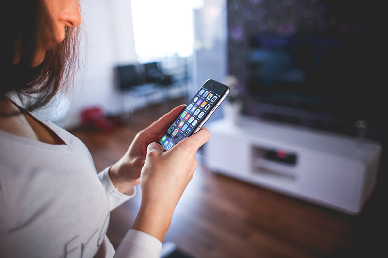 Women looking at Johnston Meier app 