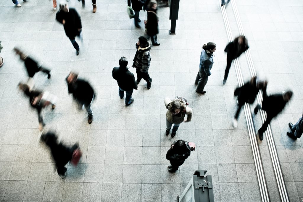 people wandering in public space