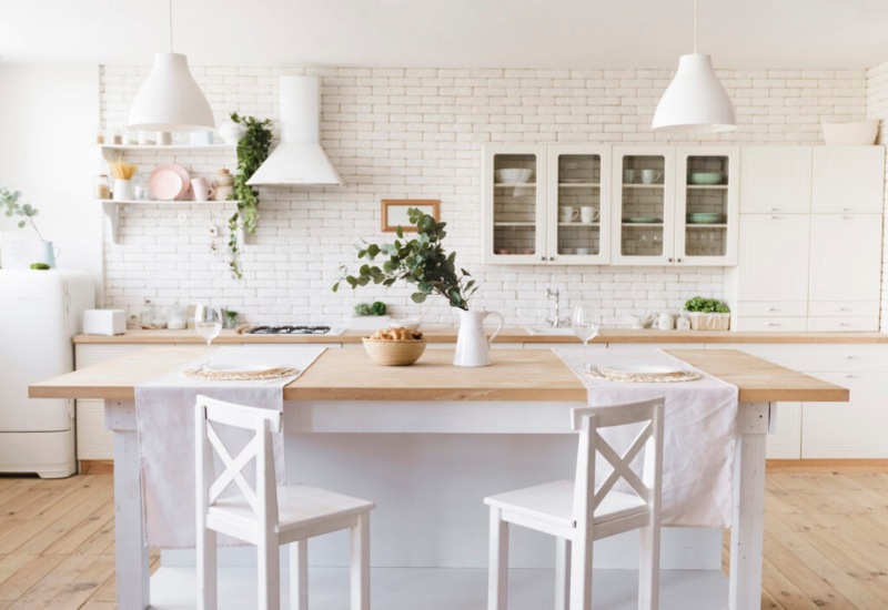 Beautiful white kitchen with kicthen island and stools