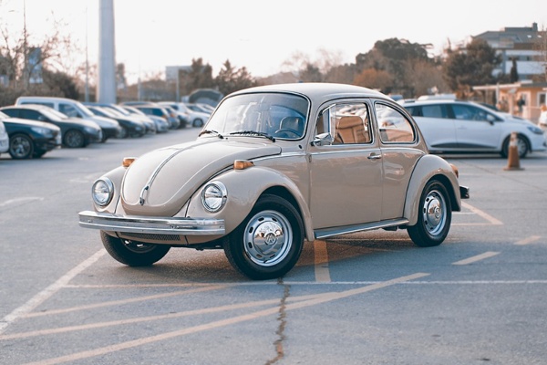 Classic Volkswagen Beetle in parking lot