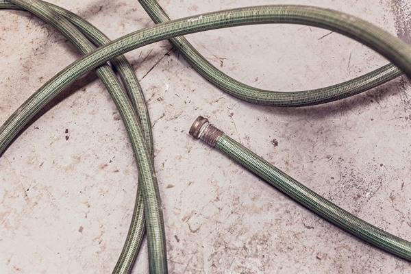 Garden hose tangled on floor