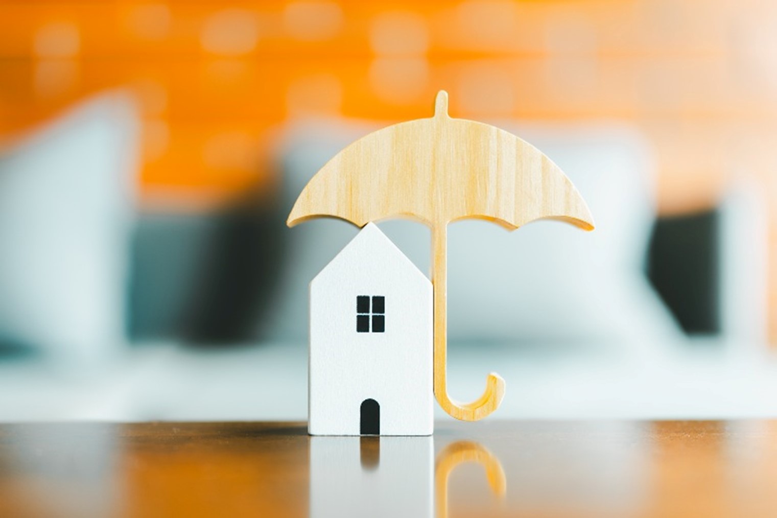 A small wooden house under a wooden umbrella by Johnston Meier Insurance Agencies Group