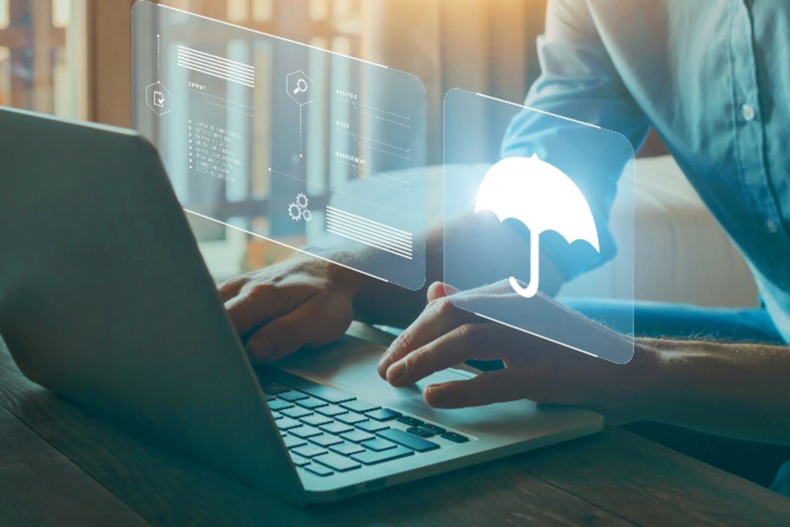 Digital images by a laptop with a person typing by Johnston Meier Insurance Agencies Group
